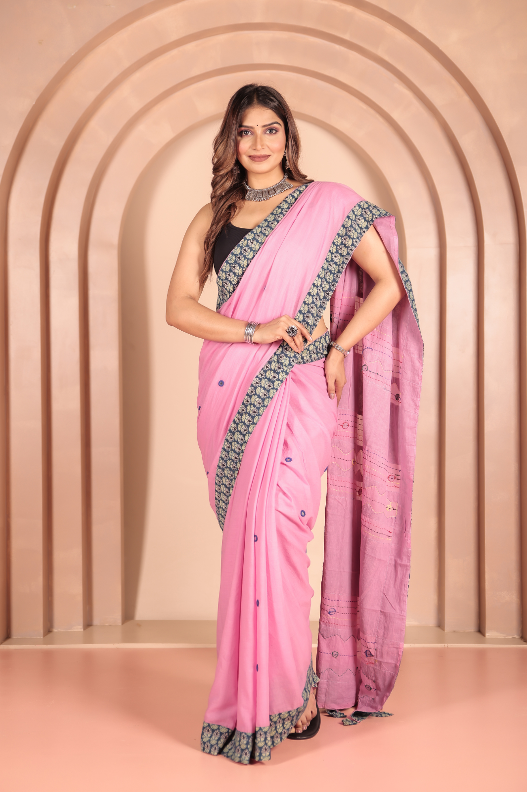 Pink saree features intricate cotton applique work