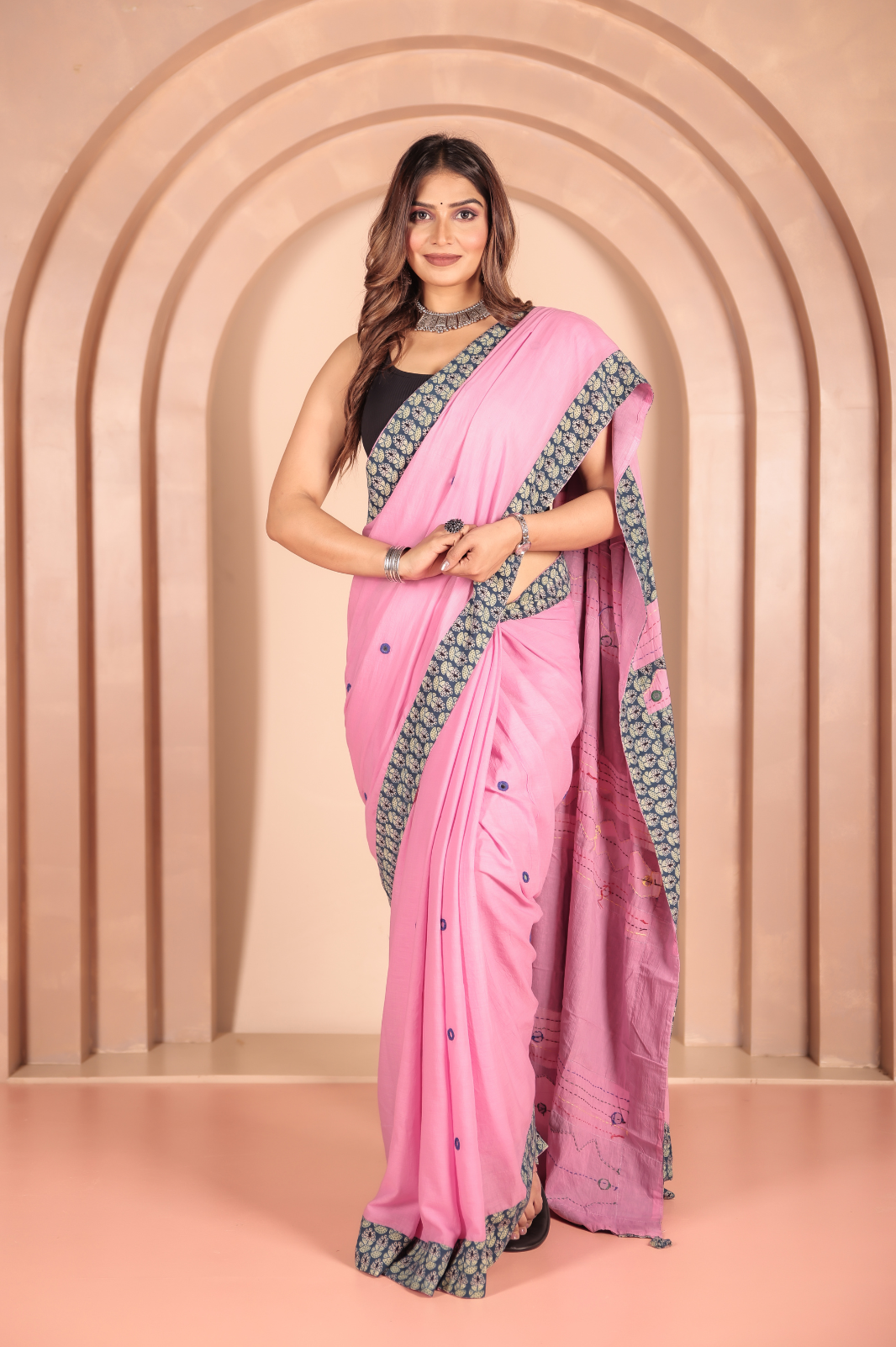 Pink saree features intricate cotton applique work