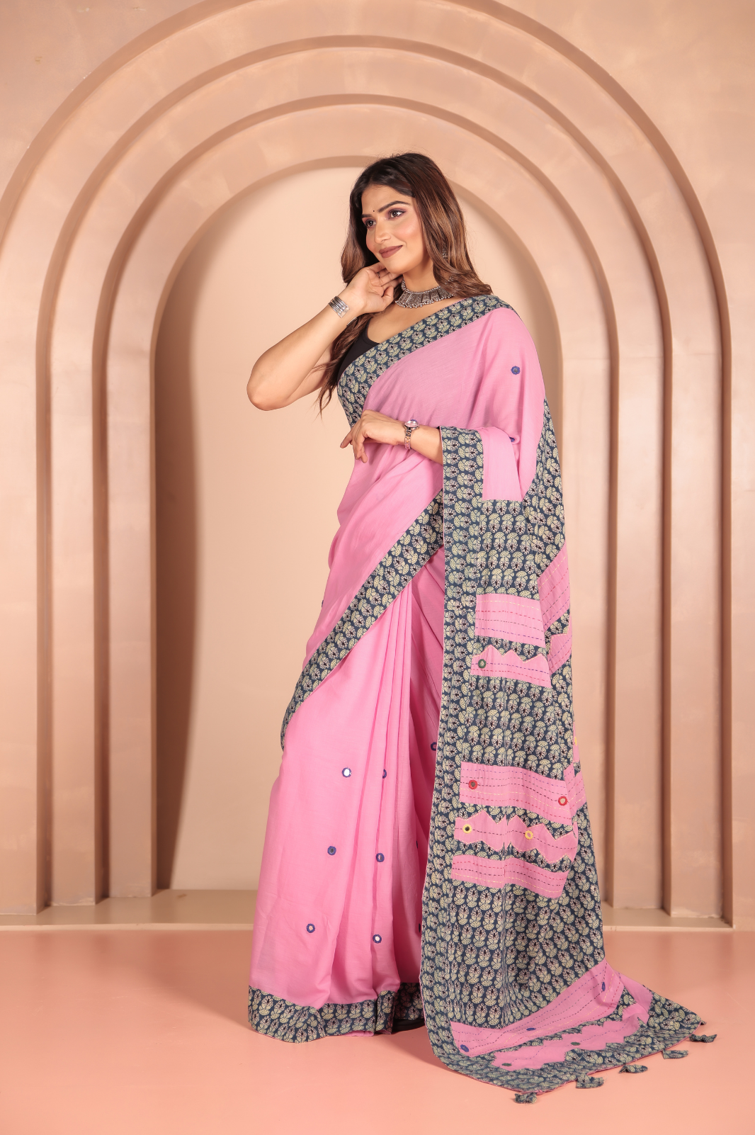 Pink saree features intricate cotton applique work