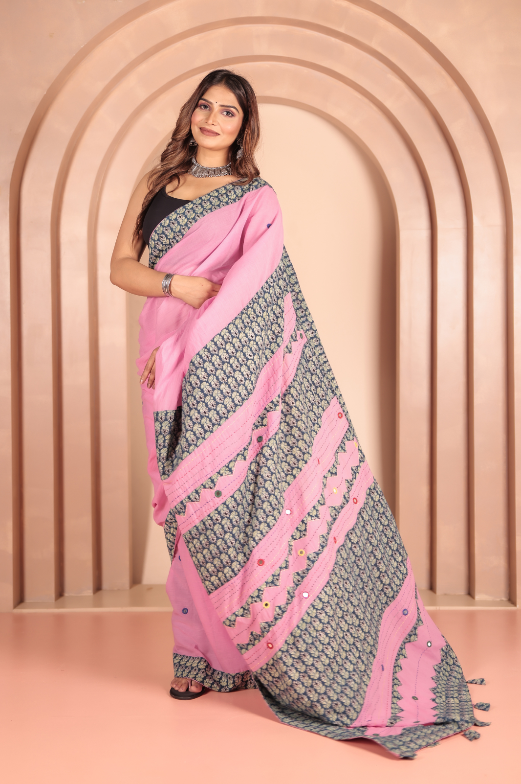 Pink saree features intricate cotton applique work