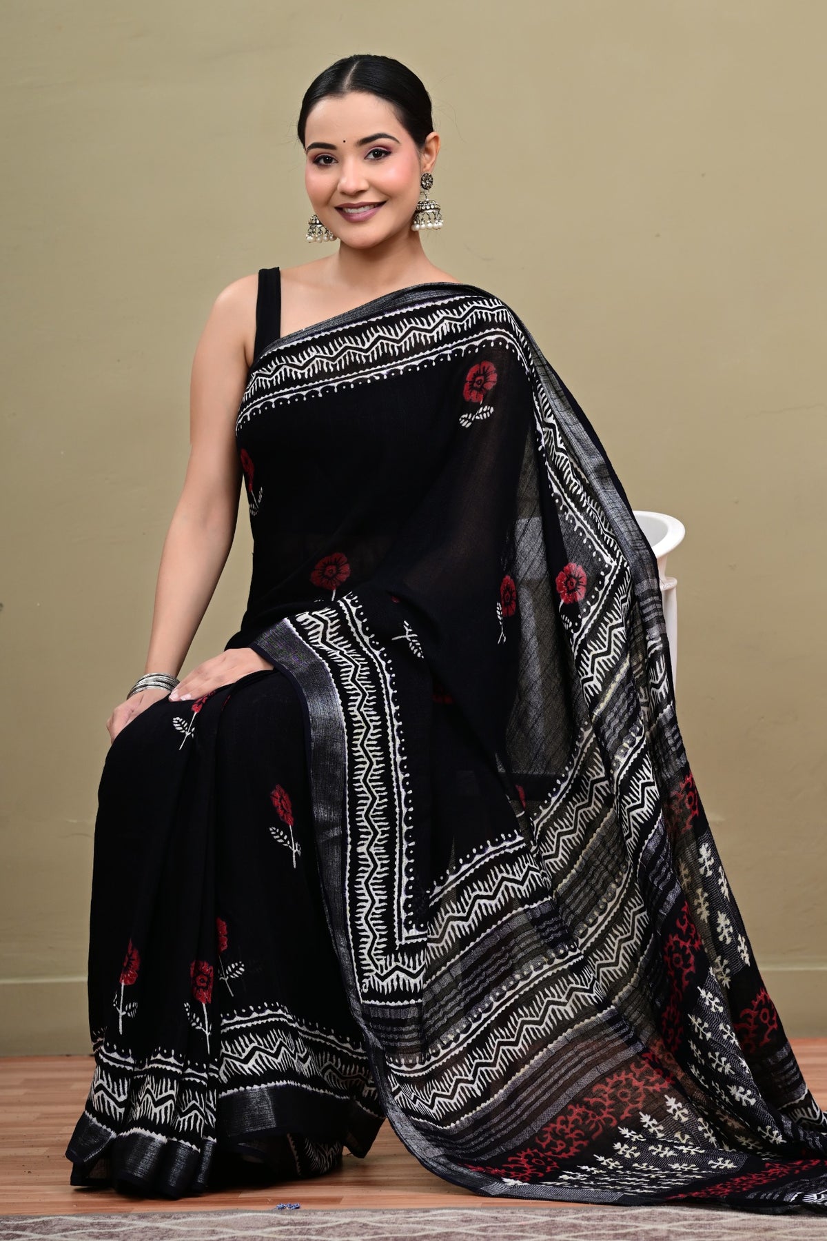 Black linen cotton handblock saree seated view
