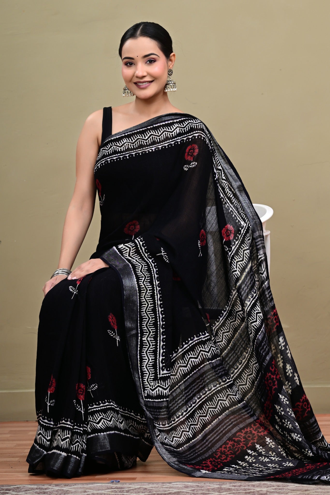 Noir Gulzar black linen cotton handblock printed saree seated view